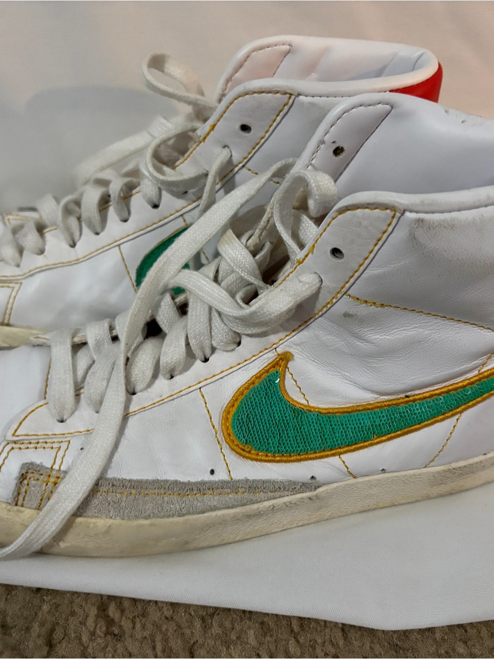 Nike Kids White High-Top Sneakers with Green and Gold Swoosh
